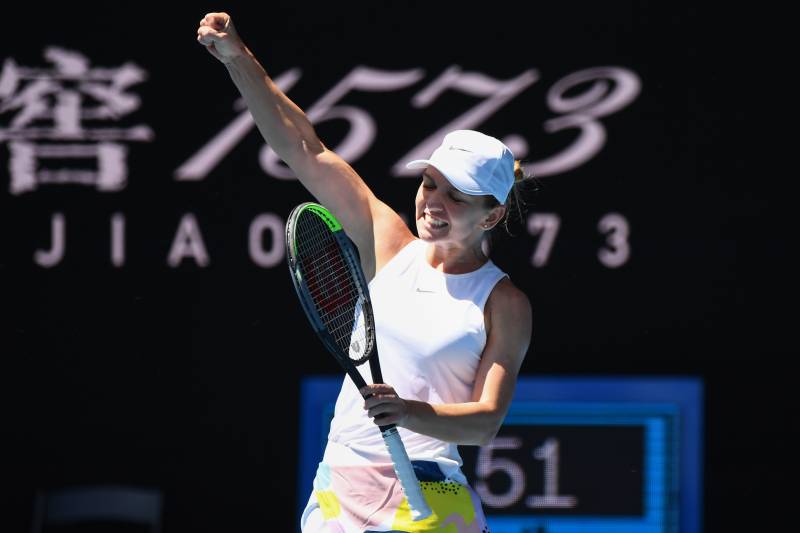 Simona Halep celebrates after scoring 