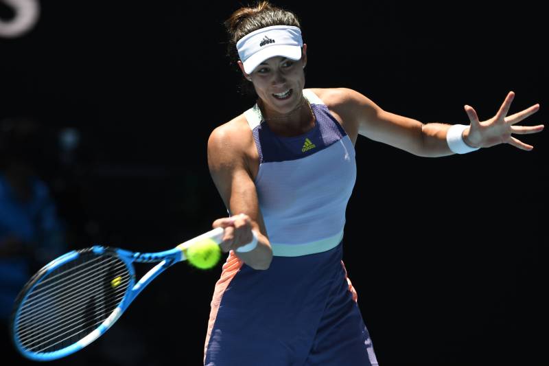 Garbine Muguruza plays a shot