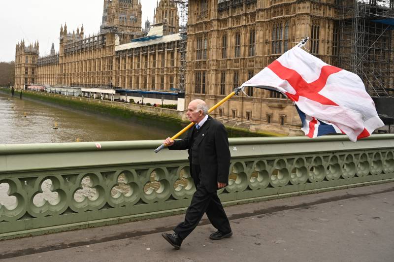 Man holding UK Flag