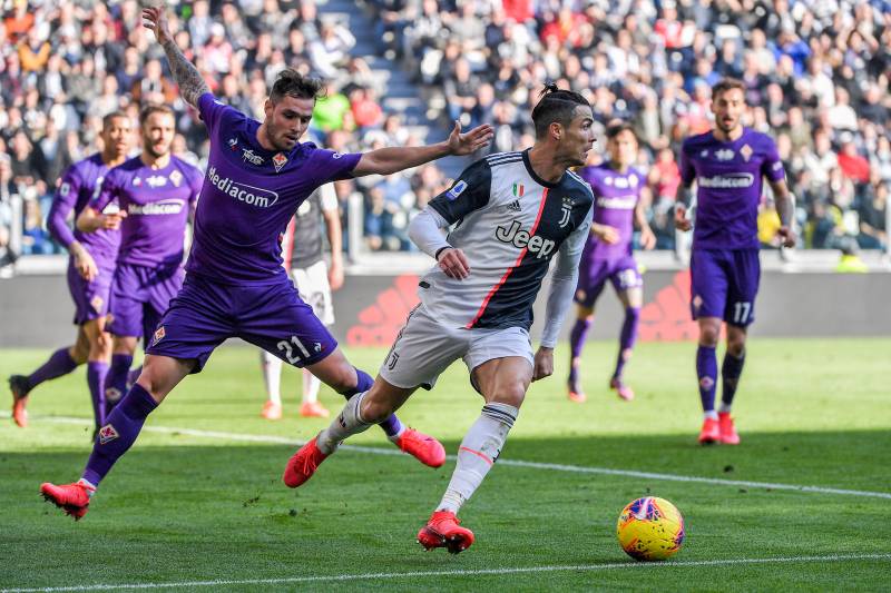 Juventus\' Portuguese forward Cristiano Ronaldo dodging rival team players