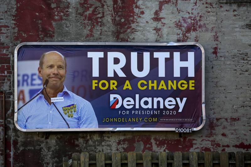 A campaign sign for Democratic presidential candidate, former Rep. John Delaney (D-MD), is displayed on a building in Des Moines, Iowa