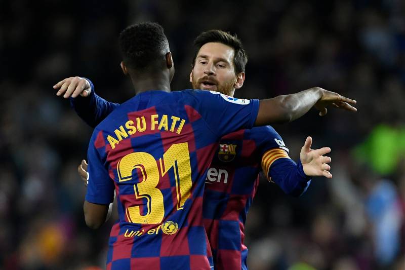 Ansu Fati celebrates with Lionel Messi after scoring a goal