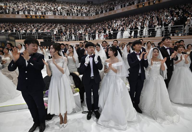 In sickness and in health: mass wedding defies virus fears