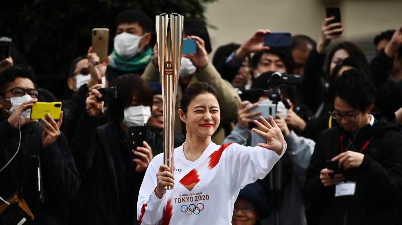 Tokyo holds Olympic torch rehearsal as spectre of virus looms