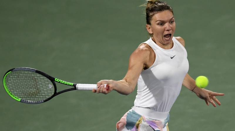 Halep downs battling Jabeur on fourth match point in Dubai