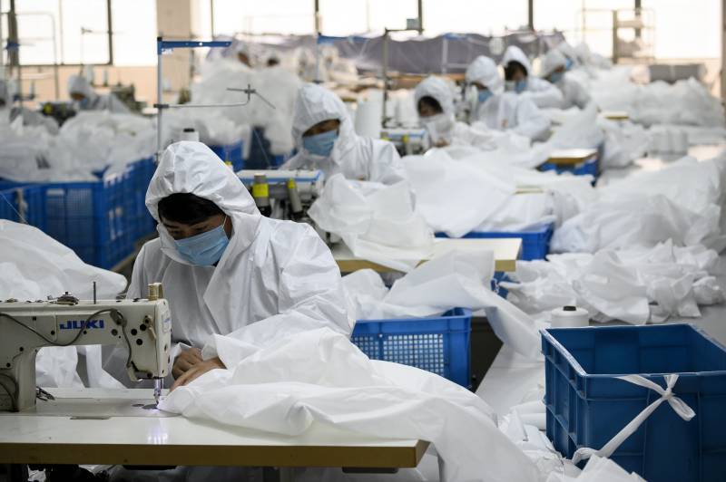 In virus-hit China, coat-maker adapts to make hazmat suits