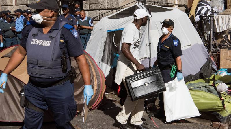 South African police evict migrant squatters from Cape Town's busy square