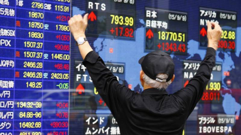 Asian markets build on gains as central banks kick into gear