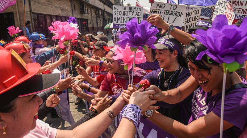 Thousands rally in Asia for Women's Day despite virus fears