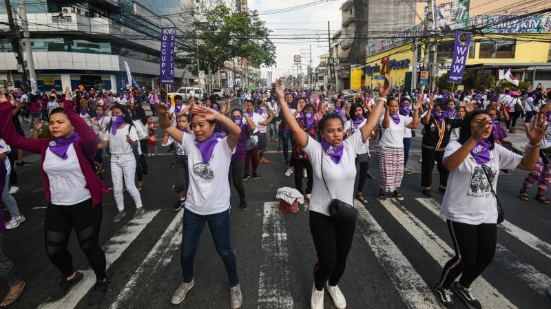 Thousands rally in Asia for Women's Day despite virus fears