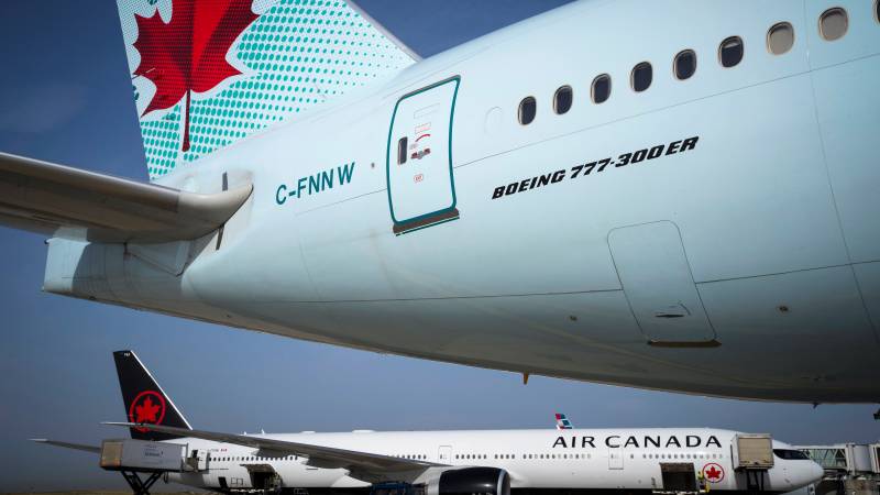 Air Canada to temporarily lay off half its workforce