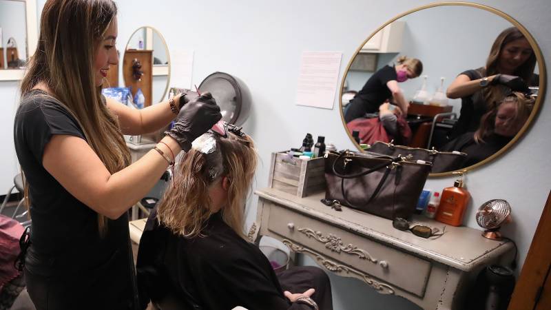 To cut or not to cut? In US, quarantine slows everything but hair growth