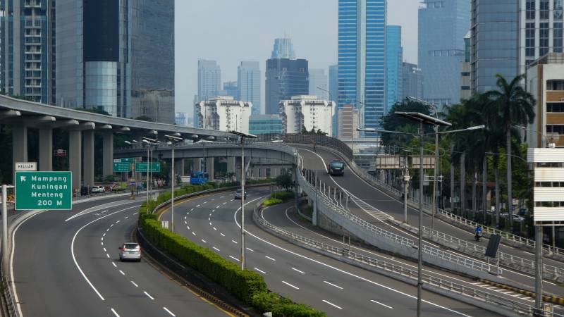 Jakarta imposes partial lockdown as virus cases surge