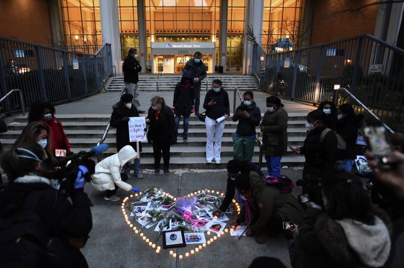 New York health workers hold vigil for colleagues who died in virus fight