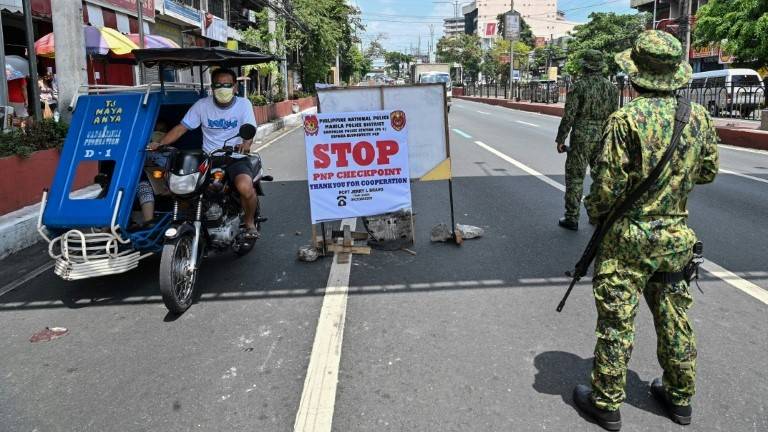 Philippines' Duterte threatens martial law-like virus crackdown