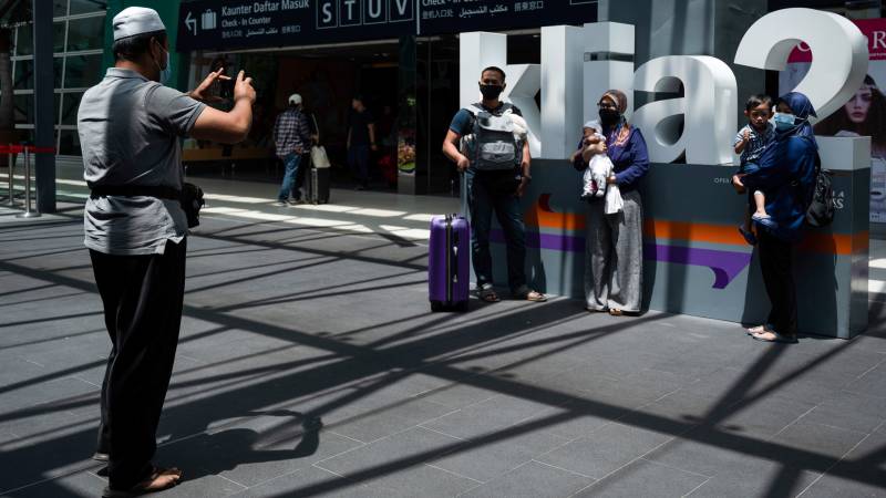 Malaysia to ease virus curbs as outbreak slows