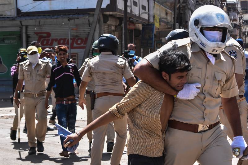 Chaos outside liquor stores as India eases virus lockdown