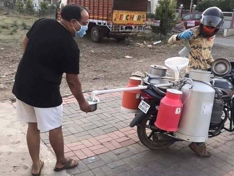 Indian milkman comes up with 'invention' to maintain social distance