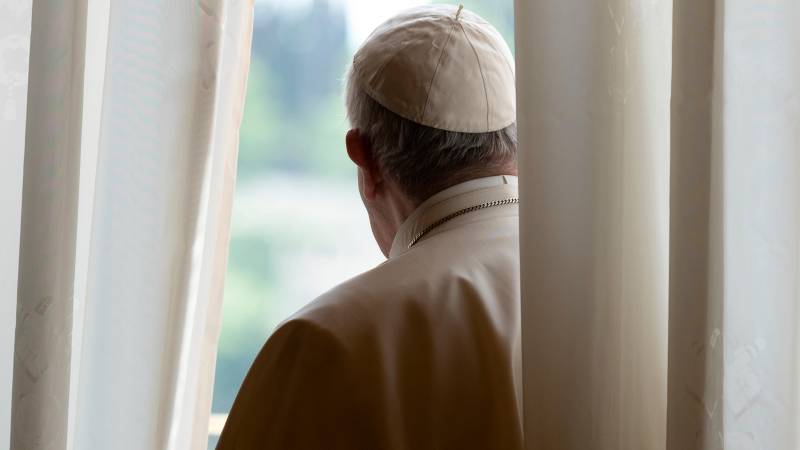 Pope Francis begs in Milan street, his cassock in tatters  