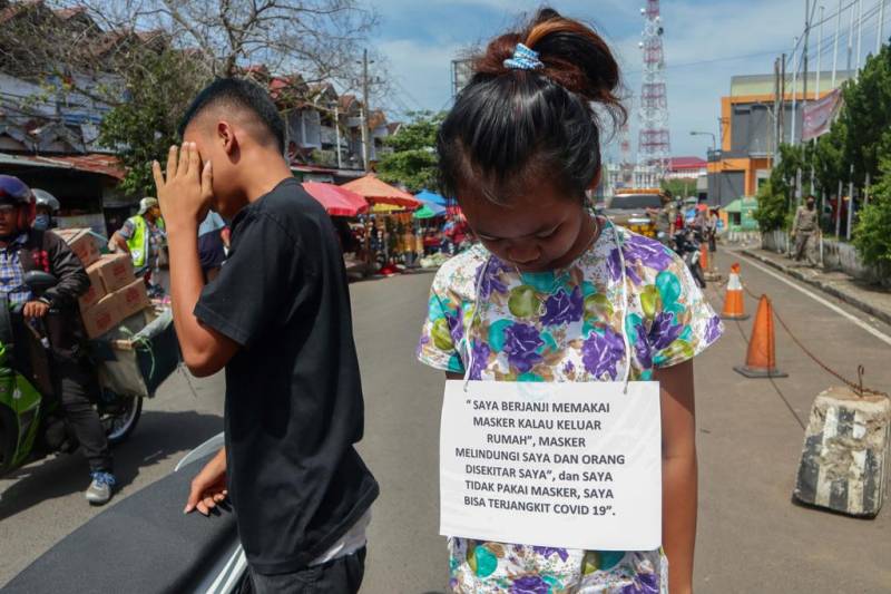 Indonesia rolls out public shaming for virus violators