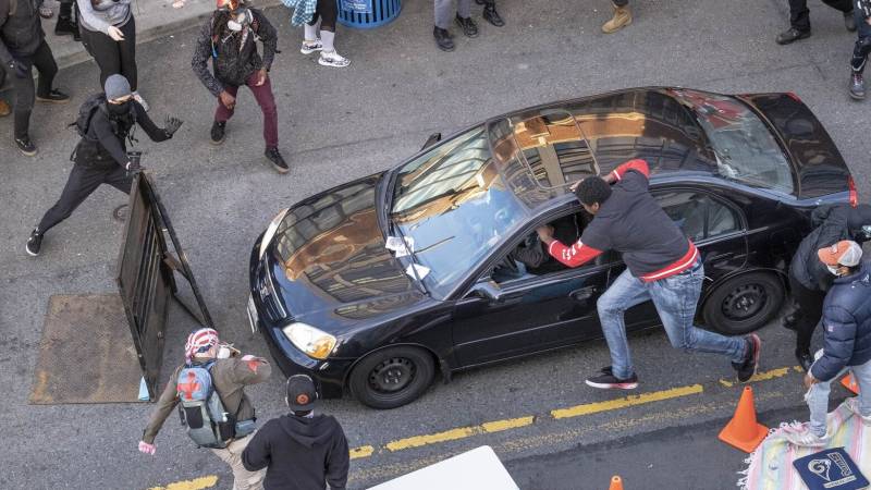 Man shot after car driven into George Floyd protest in Seattle