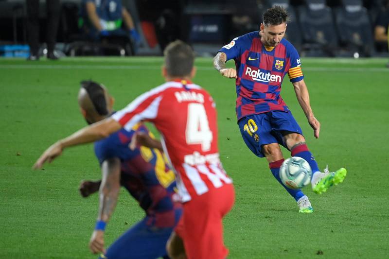 Messi scores 700th goal but Atletico draw hurts Barca's title hopes