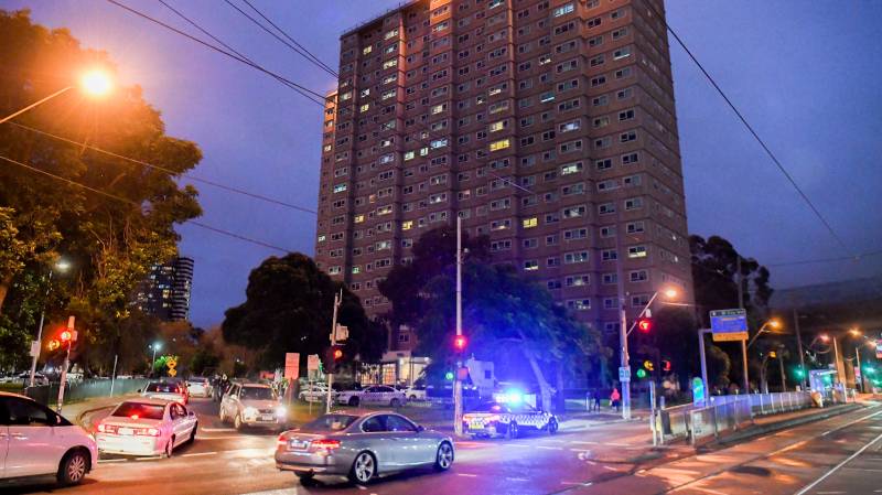 Australia locks down high-rise apartments as virus cases spike