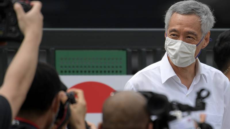 Singapore ruling party retains power but support slips in pandemic poll