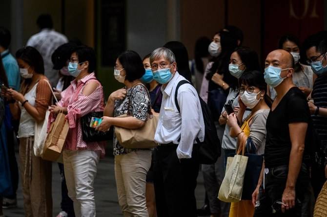 Hong Kong reimposes social distancing as virus cases spike