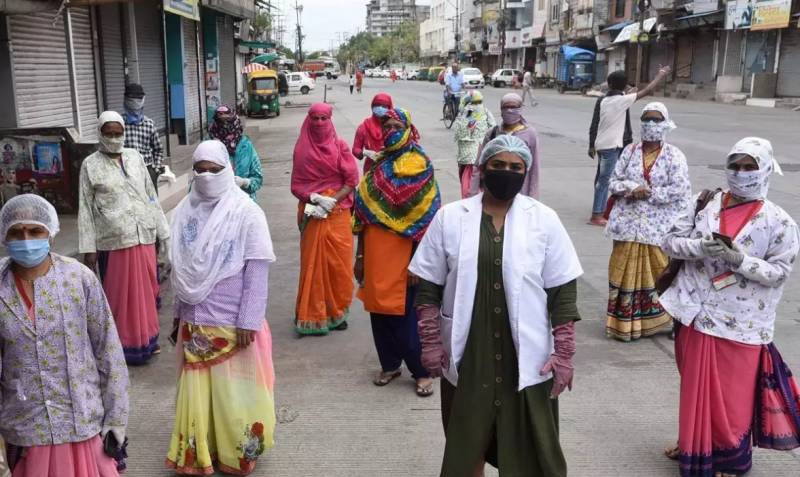 Indian women on pandemic frontline strike for pay and protection