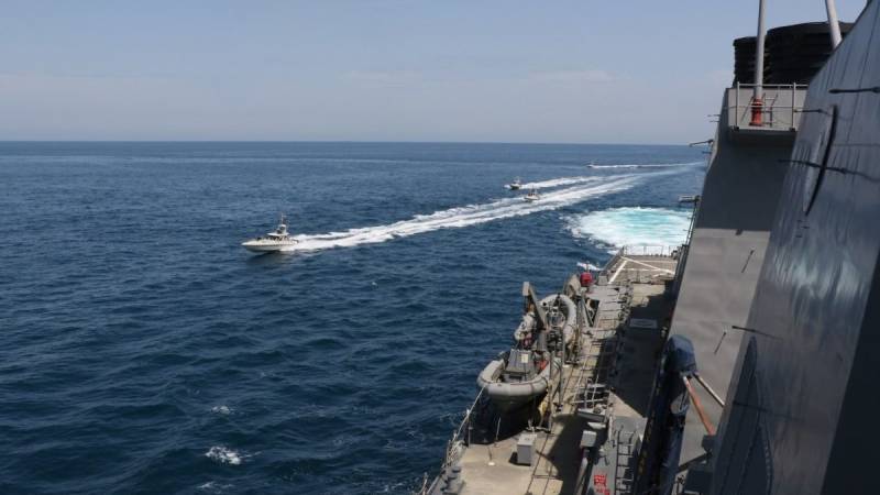 US says Iran forces board ship in international waters