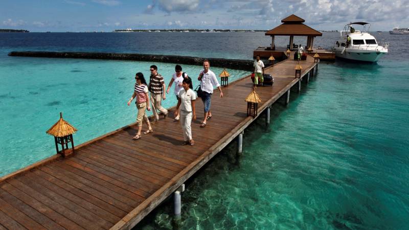 Maldives tightens tourist virus rules after spike in cases