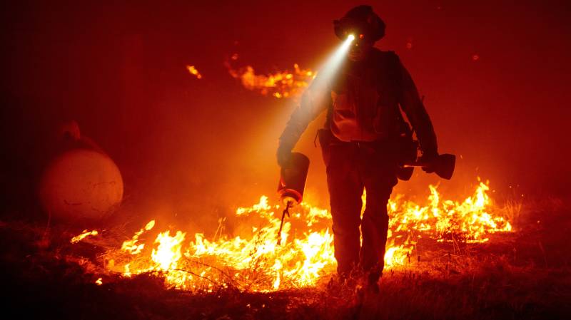 US towns destroyed as firefighters battle wildfires under orange skies