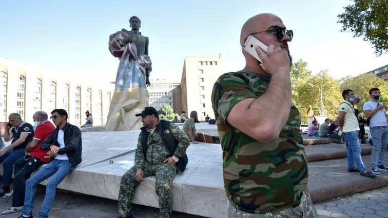 Exhausted Armenians gather at Karabakh border after fleeing fighting  