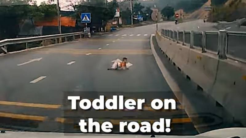 This toddler was crawling on the highway...!