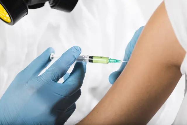 EU defends vaccine trials as UK gives first OK