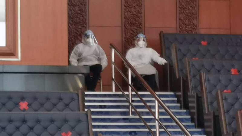 Malaysian ministers wear PPE in parliament, opposition walks out