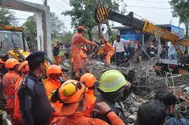 At least 20 dead in India cremation building collapse