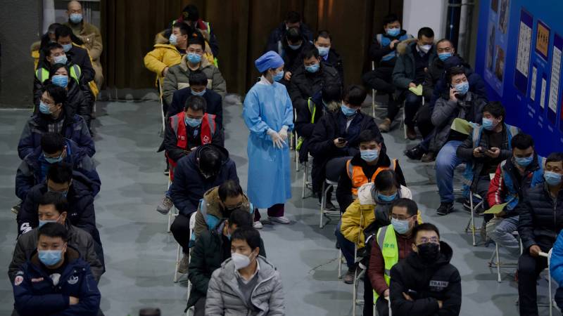 China puts 20,000 villagers in central quarantine over virus risk