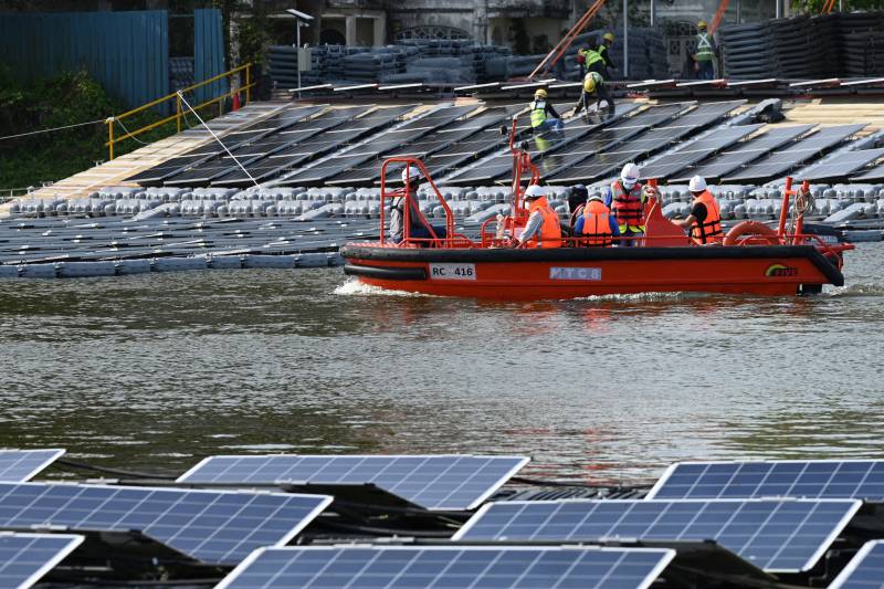 Space-starved Singapore builds floating solar farms in climate fight