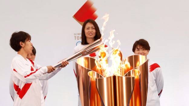 'Ray of light': Olympic torch relay begins after year's delay