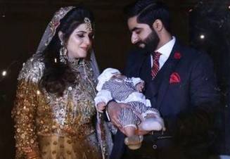 Little boy attends parents walima