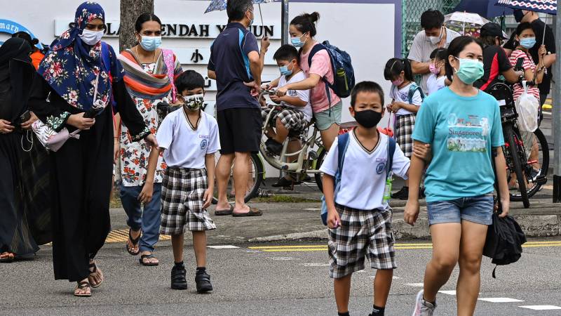 Singapore shuts schools after new virus strains infect more children