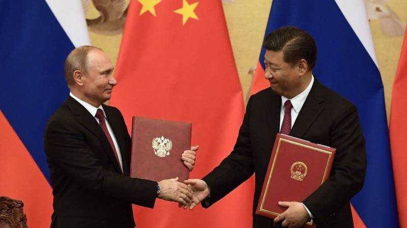 Putin, Xi hail ties at launch of work on nuclear plants in China