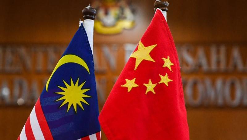 China says military flight off Malaysia was 'routine training'