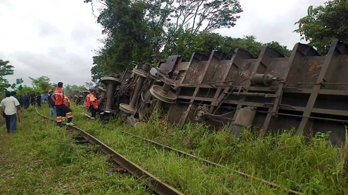 One dead as freight train topples onto Mexican homes