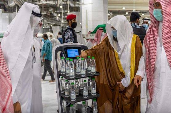 Socially distanced robots serve Mecca holy water ahead of Hajj