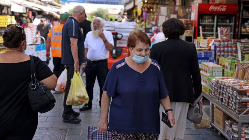 Israel resumes indoor mask requirement amid virus spike