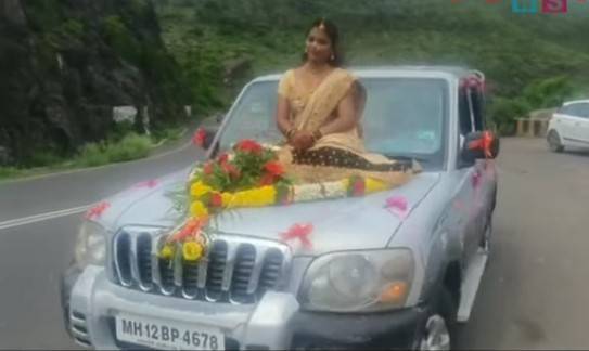 Bride rides on bonnet of moving SUV, booked for not wearing mask