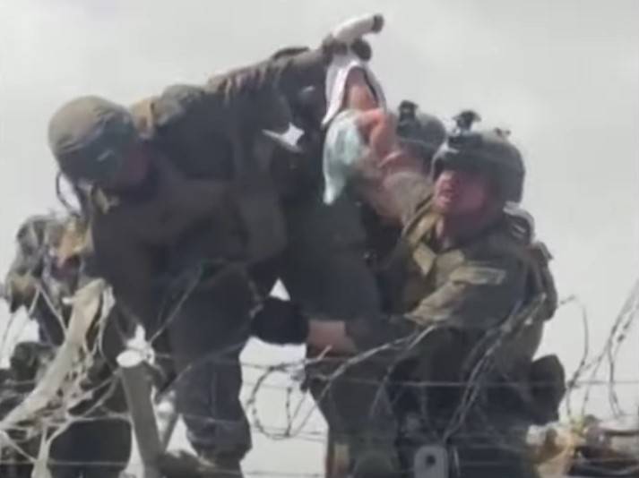 Viral footage of US Marine aiding baby captures Kabul chaos